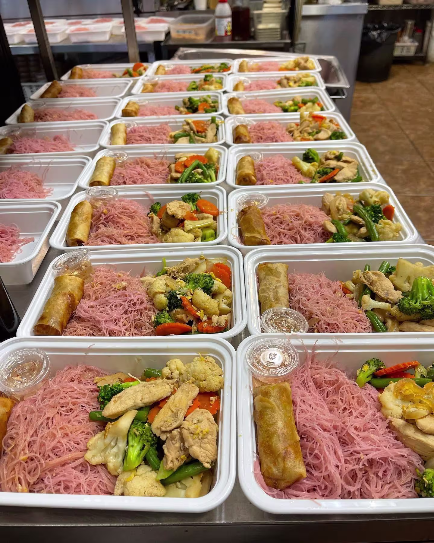 Individually boxed Thai meals with rice and stir-fry